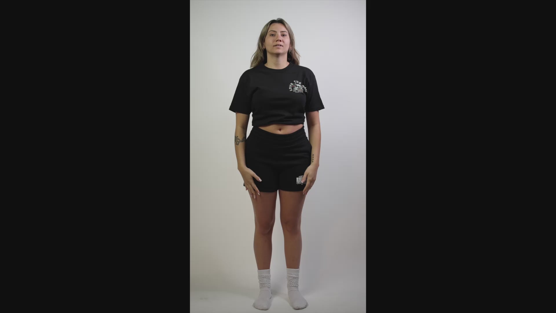 Video of the Love the Pain Tee featuring front, side, back, and other side angles.