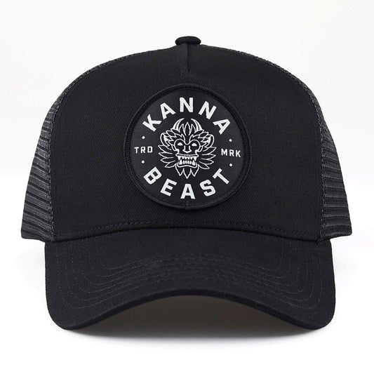 Kanna Beast Trucker Hat in all black against a white background. 