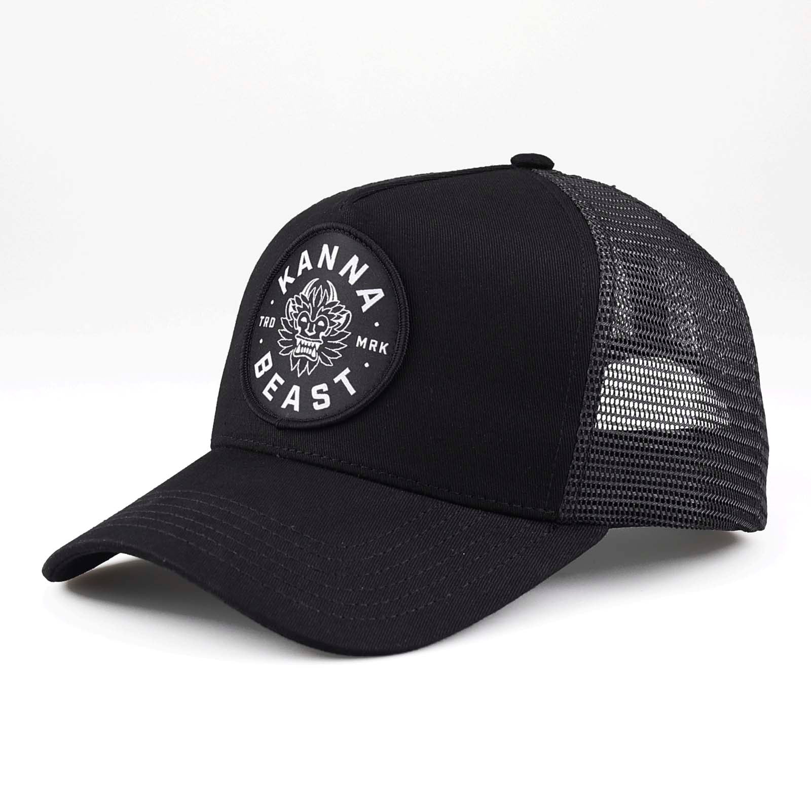 Kanna Beast Trucker Hat in all black against a white background. 